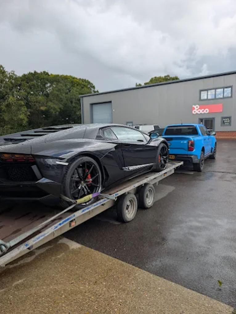 Lamborghini Aventador loaded on a transporter