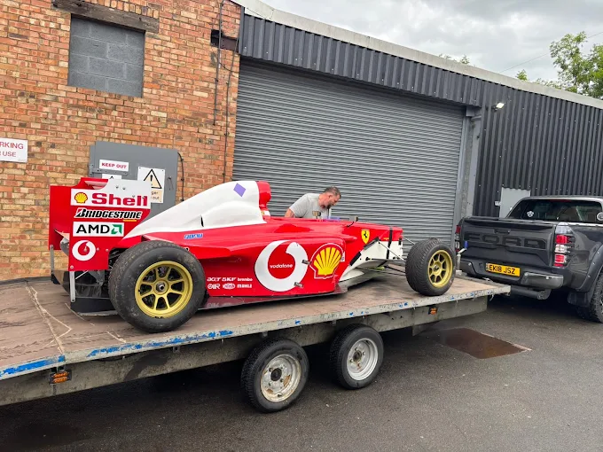 Ferrari Formula 1 car secured on a trailer