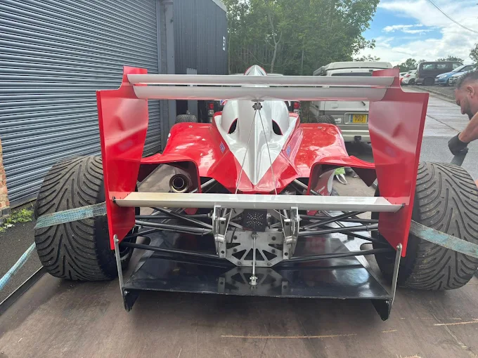 Race car transported on a flatbed