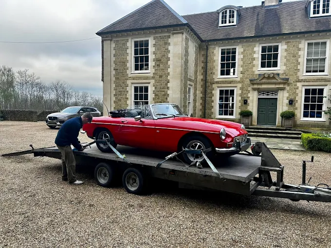 Classic MG convertible collected from a country house
