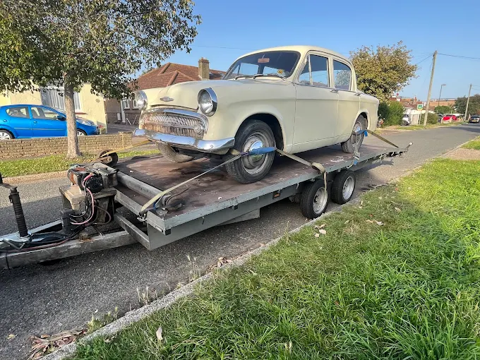 Classic car loaded on a transporter